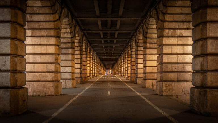 A street is going through arches during the golden hour