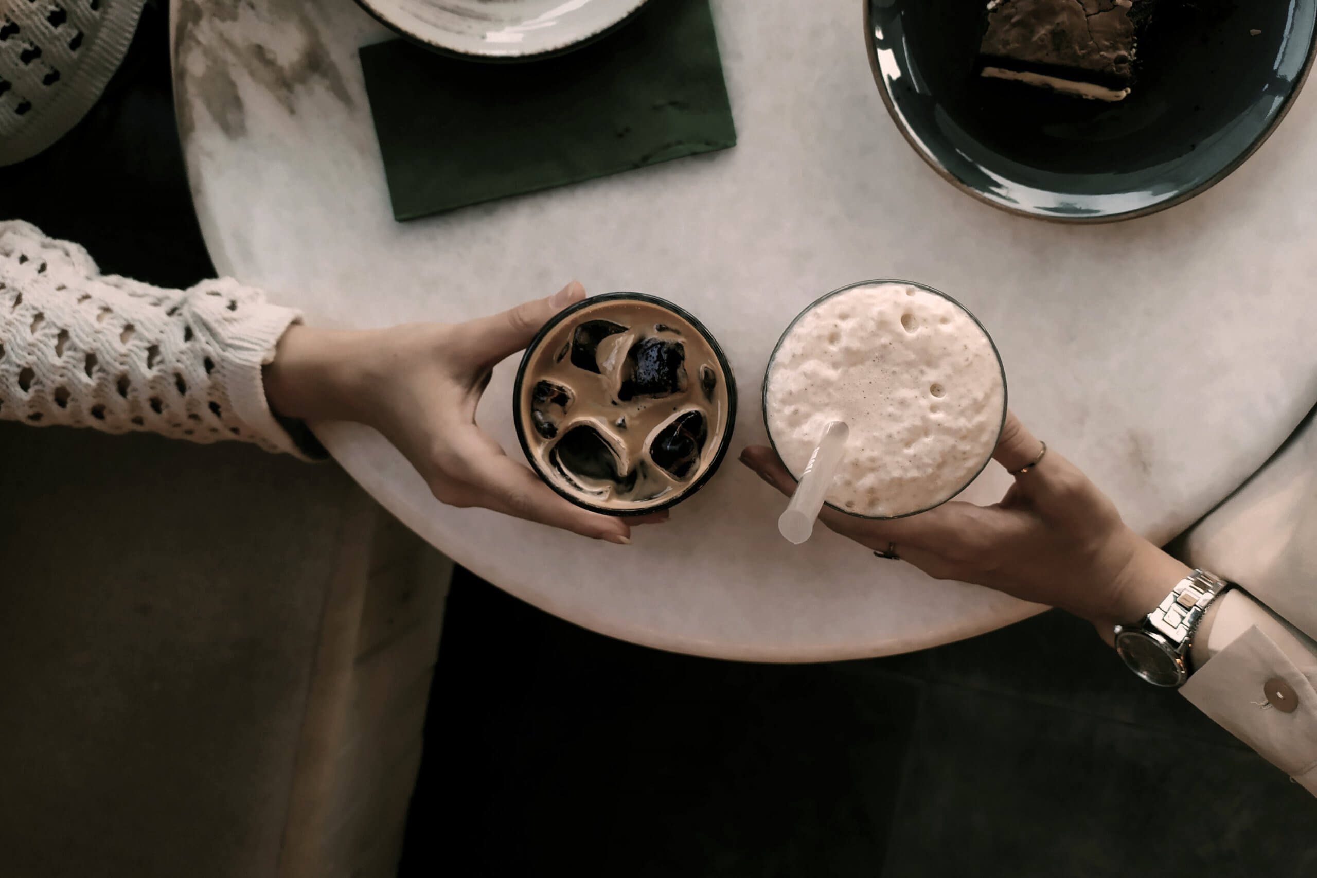 Two women drinking coffee and building trusted relationship